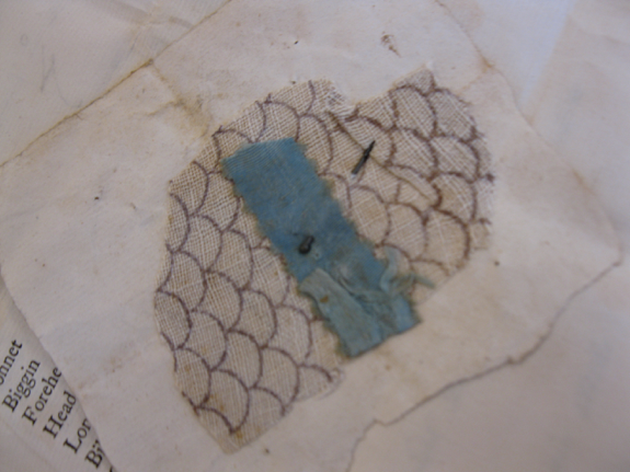 Heart-shaped paper and cloth token.